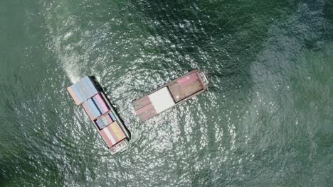 small feeder class container ship in hong kong bay, aerial view