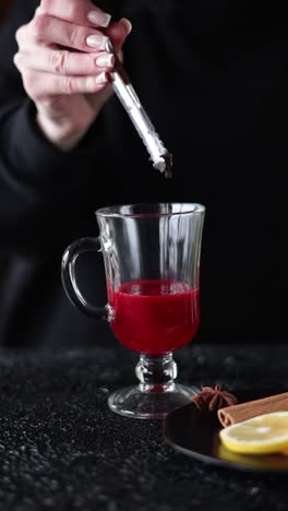 woman preparing a spiced winter drink