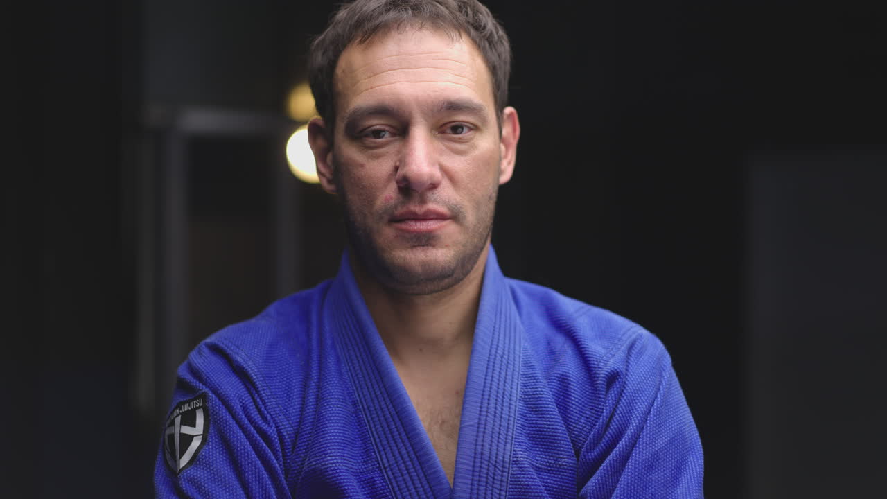 Portrait of a man in a blue gi