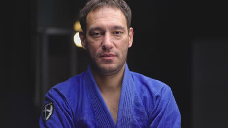 portrait of a man in a blue gi