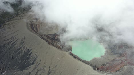 drone view of santa ana volcano with crater lake in el salvador and surrounding rugged terrain