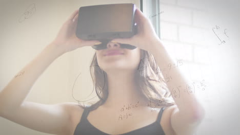 animación de dibujos matemáticos y ecuaciones sobre mujer usando auriculares vr