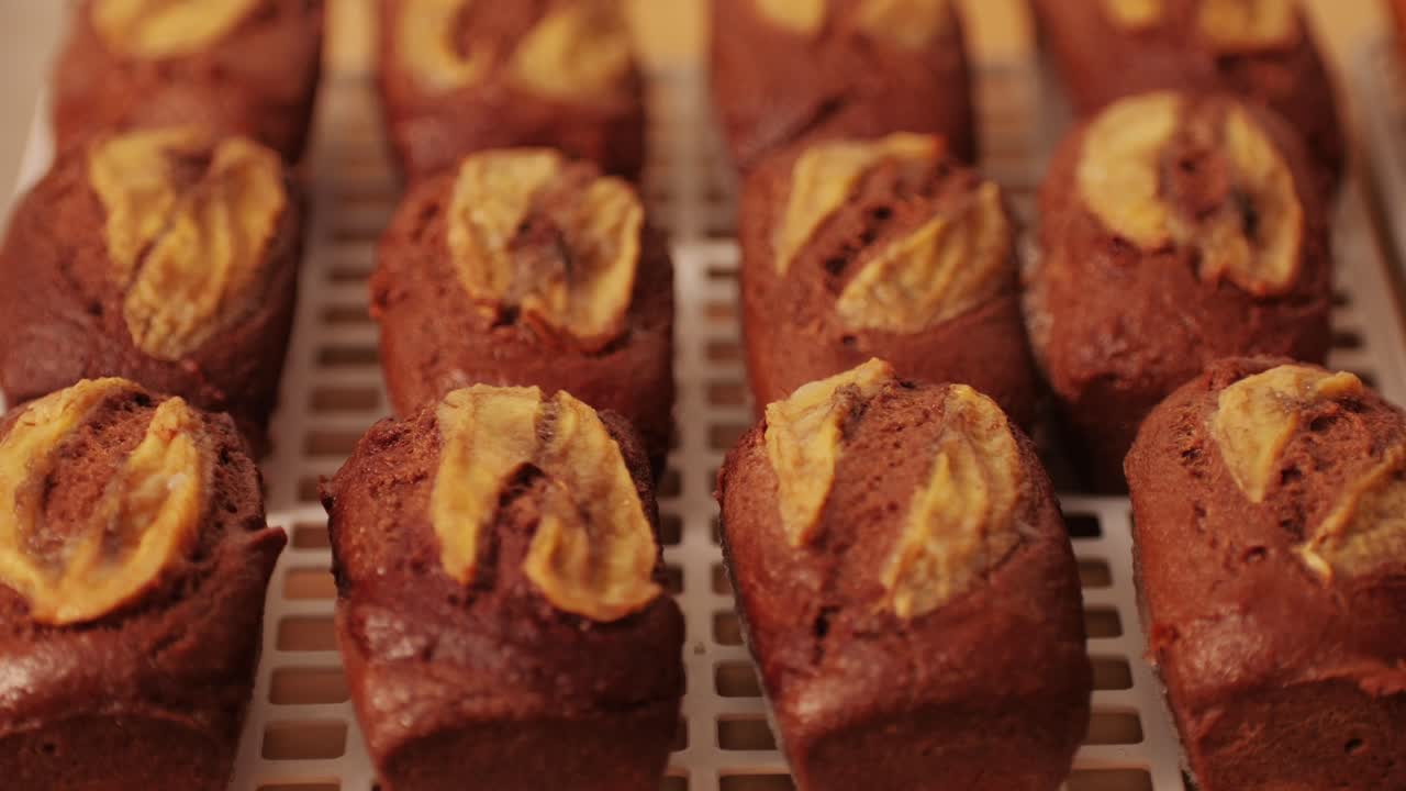 Fresh bake double chocolate banana artesian bread in bakery shop close-up. Artisan bread is making by skill bakers using natural and high-quality ingredients. Food with health and flavour benefits. Sweet breads for dessert and breakfast
