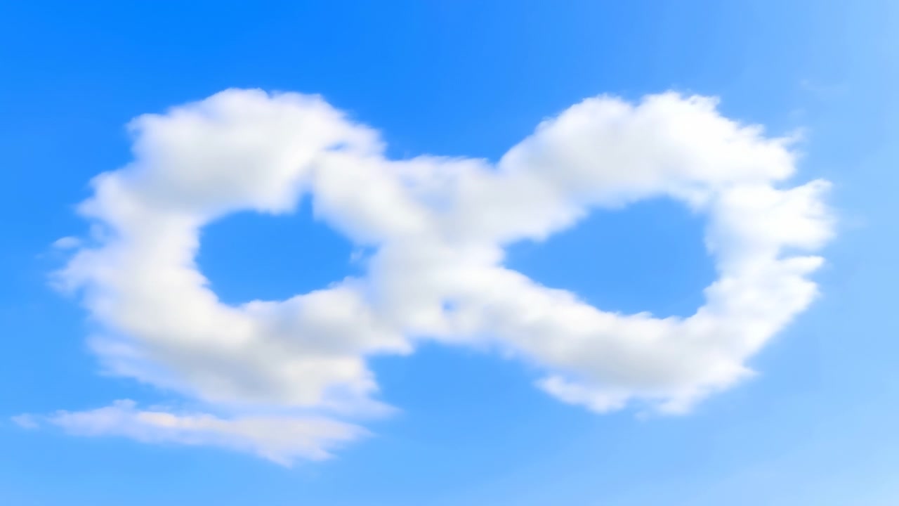 White clouds shift through blue sky as rounded vapor patterns transform and separate, with sunlight illuminating soft edges and wide open composition during calm outdoor weather conditions.