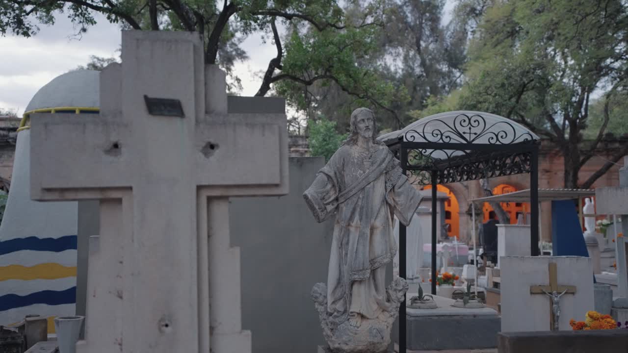 Cemetery with Statue and Cross