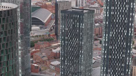 manchester deansgate aerial view close up orbiting contemporary tall geometric glass skyscrapers