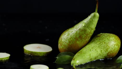 the pear slices fall on the water with splashes.