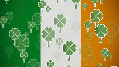 digital animation of multiple clover leaves floating against irish flag