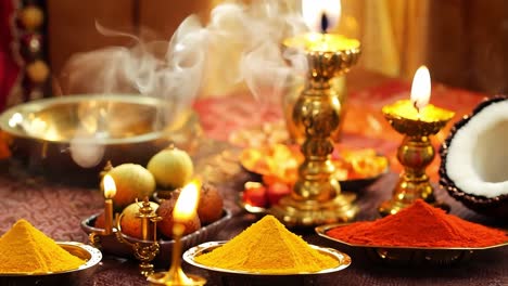 close up of candles and spices during an indian religious ceremony