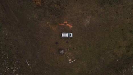 SUV-parked-at-the-bottom-of-a-valley-isolated-in-the-Stemwinder-Provincial-Park-in-British-Columbia,-Canada