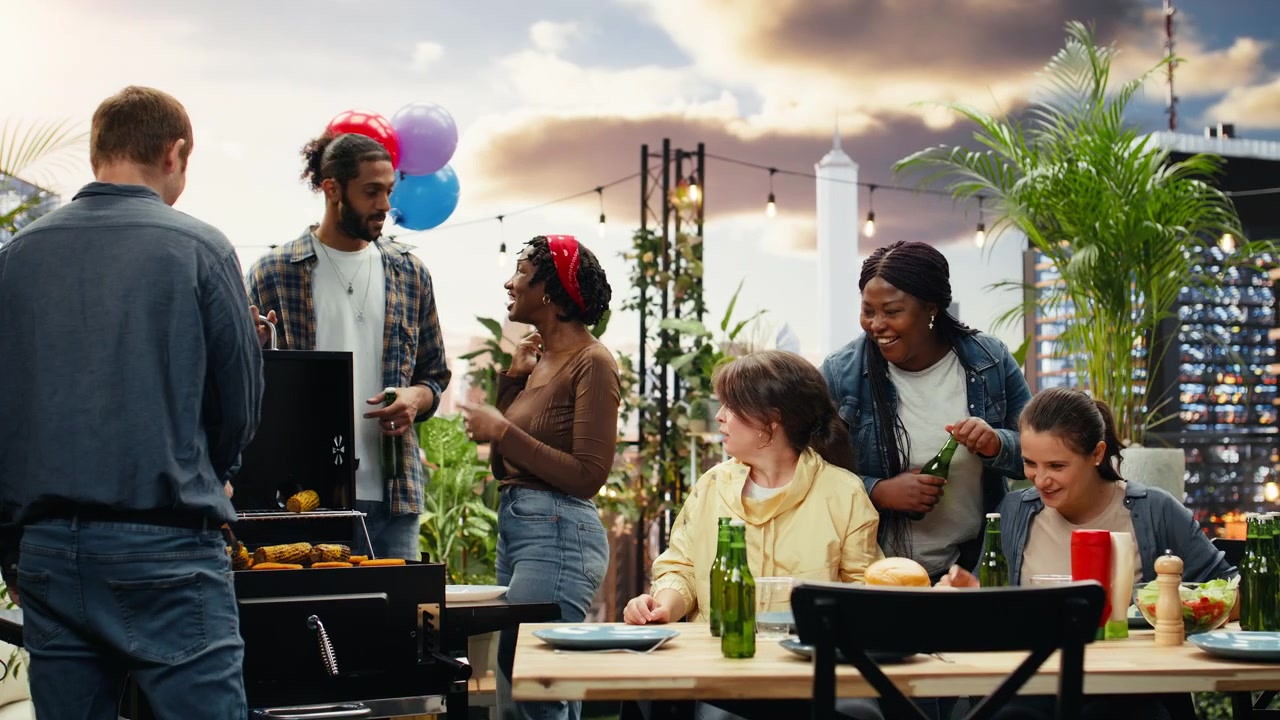 Woman gesturing during conversation with friends at rooftop barbecue party