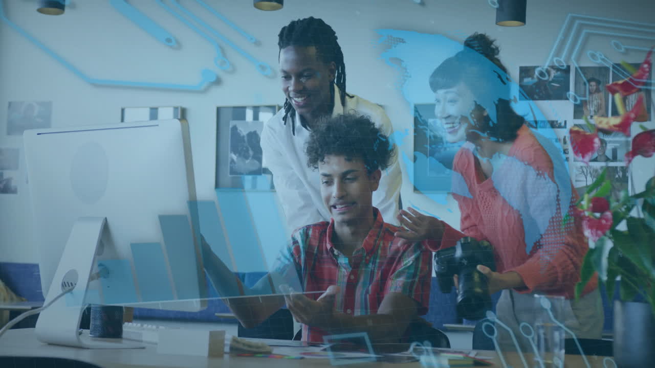 In office, diverse team collaborating on digital animation and graphics project