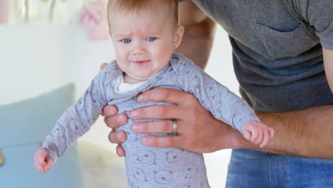 father holding his baby boy 4k