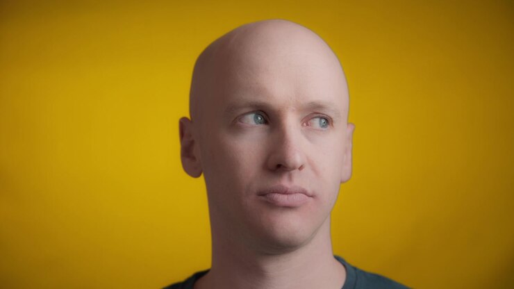 Man with an unamused face