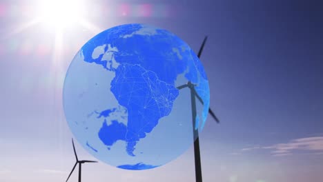 animation of globe over wind turbines in countryside