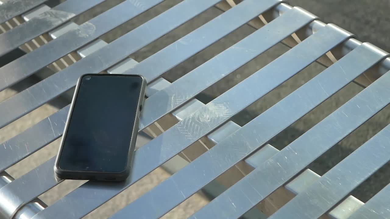 Smartphone on a Metal Bench