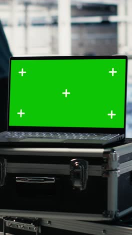 vertical video close up of isolated screen laptop in front of data center programmers