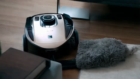 modern robotic vacuum cleaner on wooden floor