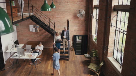 Crane-shot-in-busy-office-open-plan-boardroom-area