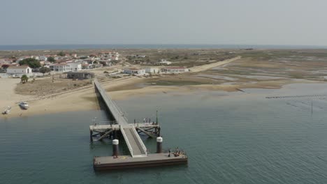 aerial view of culatra island pier in faro, portugal