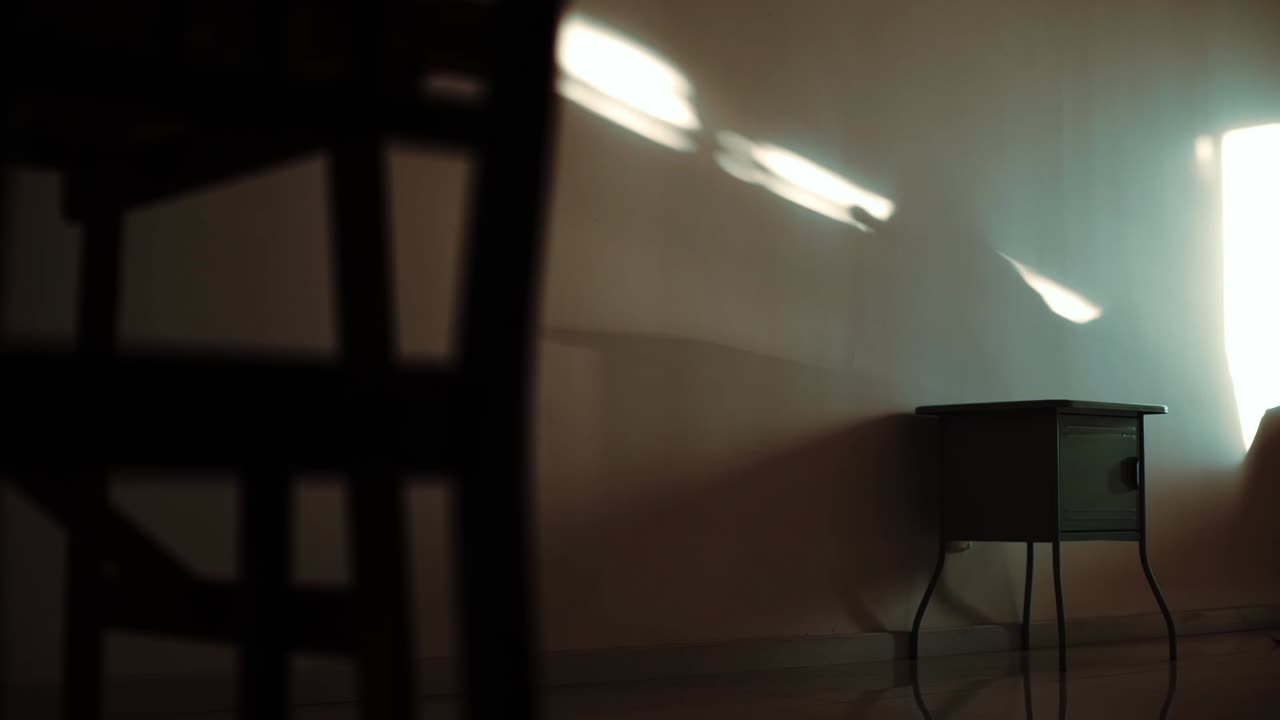 bedside table at the sunset living room. minimal furniture arrangement. nature light during sunset.