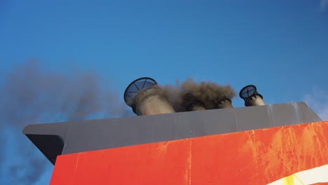 dirty smoke escaping from ship exhaust, pollution concept shot