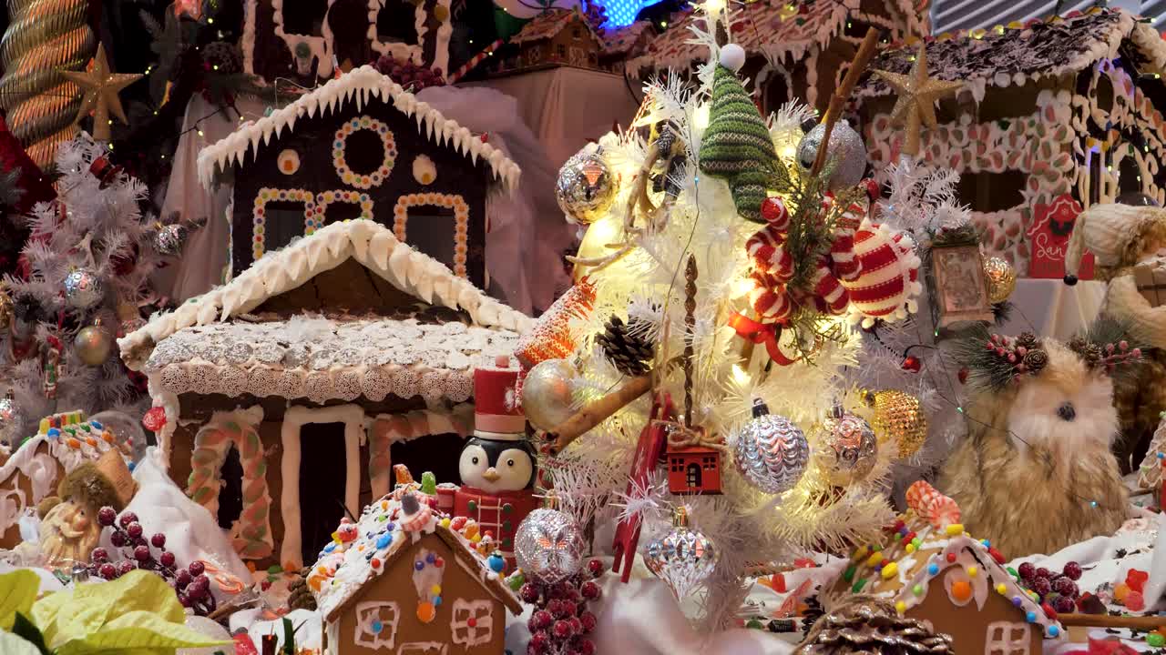 Christmas decorations arrangement, Christmas traditions with gingerbread houses, candy's, toys, Christmas tree and lights.