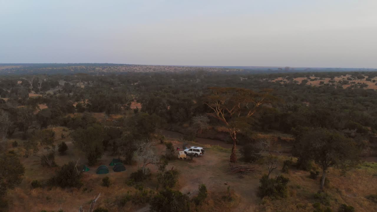 Sunrise near a river and campsite in Ol Pejeta, Kenya