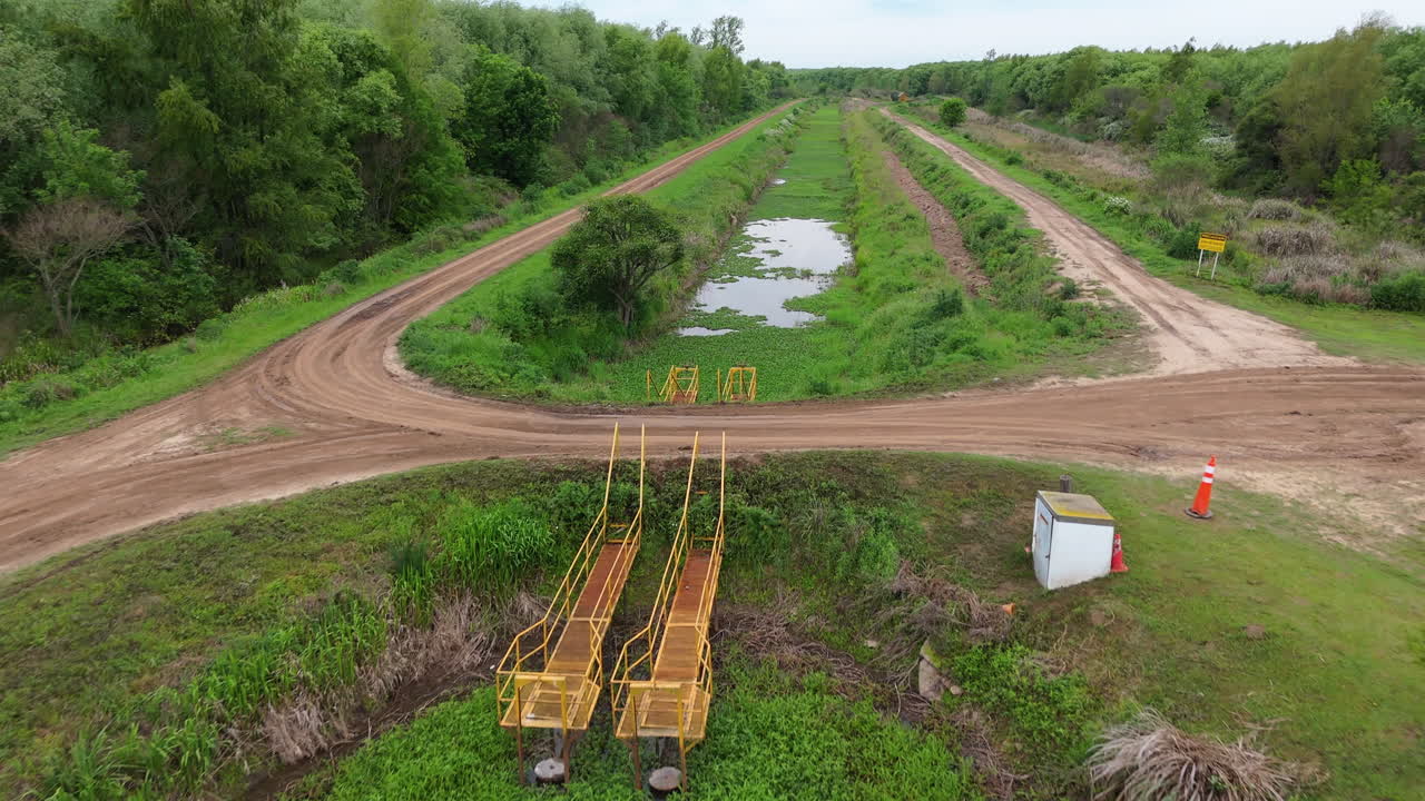 Aerial shot of a water pump station in the lush Paraná Delta countryside