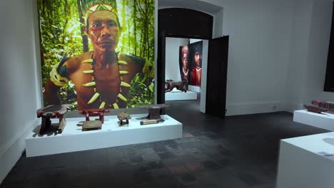cultural art exhibition with indigenous themes and sculptures