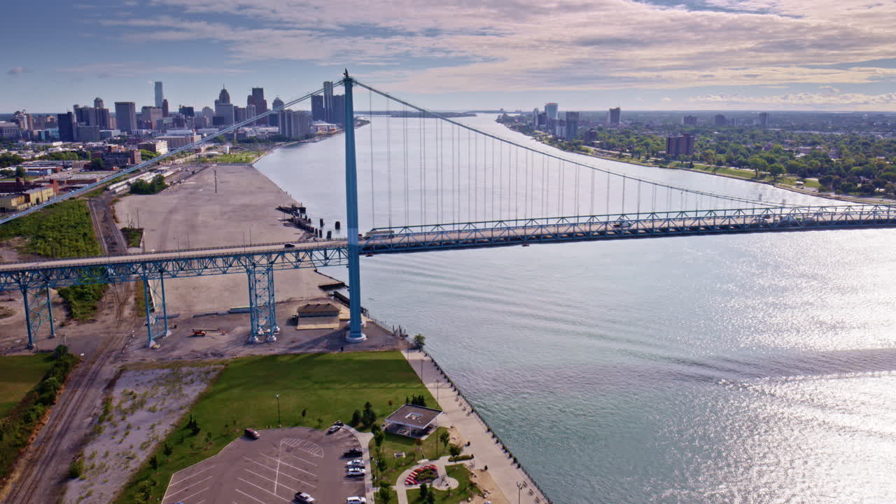 Drone camera gracefully circling the international bridge linking Canada and America
