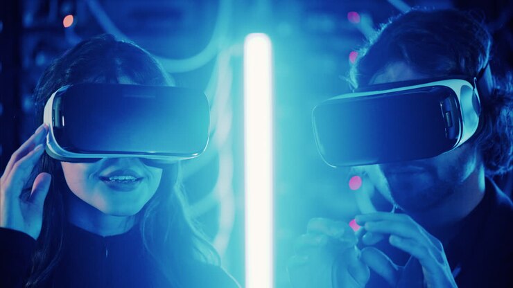 A man and a woman using Virtual Reality headsets in a server room