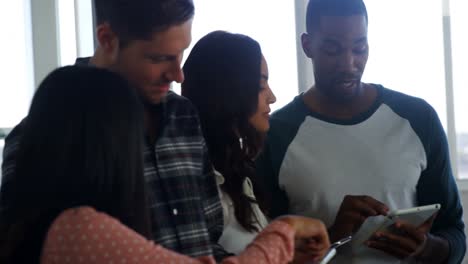 colleagues using digital tablet