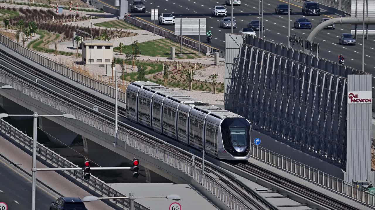 A Dubai Tram moves along Sheikh Zayed Road at Dubai Marina in the UAE.