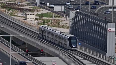 a dubai tram moves along sheikh zayed road at dubai marina in the uae.
