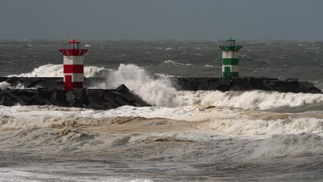 powerful rough stormy waves crashing in promenade with lighthouse