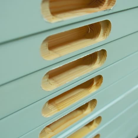 manufacturing of doors. pile of wooden doors in workshop. holes in boards during furniture production. door industry.