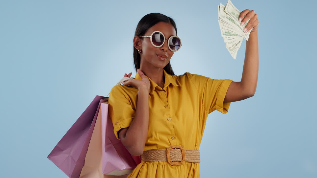 Rich woman, money fan and shopping bags