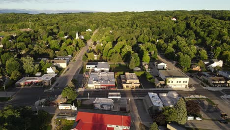 scenic village of suttons bay with surrounding lush trees in michigan, usa