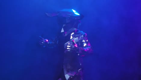 performing artists in reflective suits with animal masks