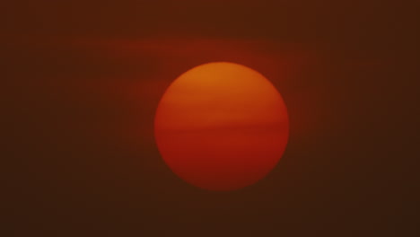 sun covered in smoke fog and city pollution during sunset or sunrise