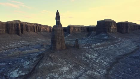 sharp rock formations in mountainous valley under sunset sky