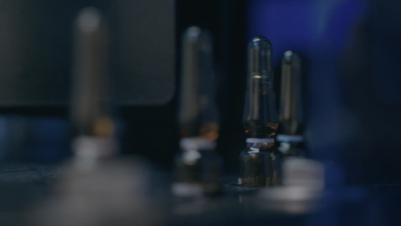 machine moves bottles with medication in circular motions, ensuring smooth processing and organization