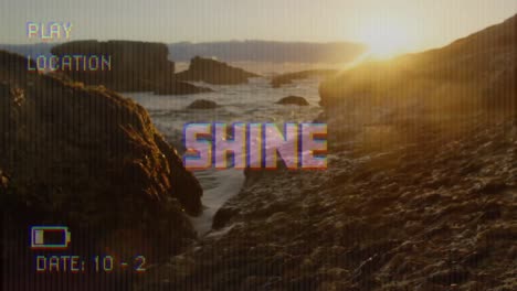 Animation-of-shine-text-on-video-camera-screen-with-digital-interface-filming-landscape