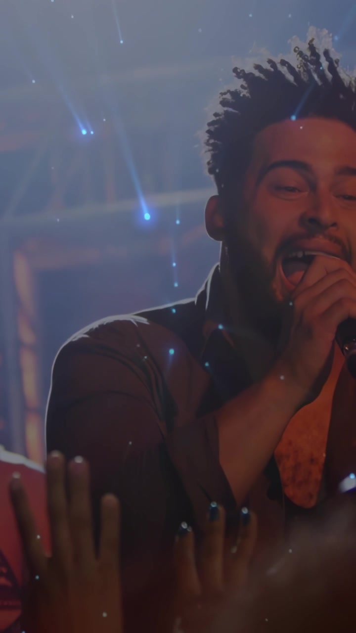 Vertical video: Male singer holding mic singing at concert comets drifting over face engaging crowd
