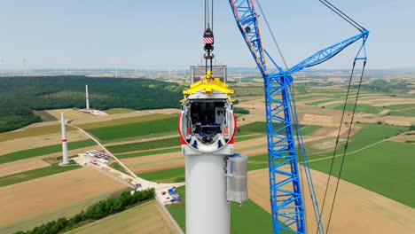 Windmill-Head-Construction-With-Big-Crane---aerial-drone-shot