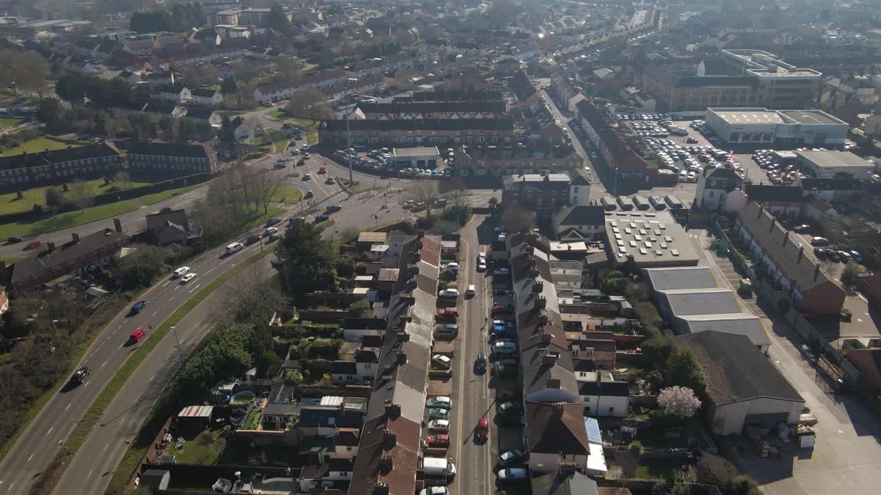 4K aerial view of a residencial area in taunton Somerset, United Kingdom, drone moving forward and showing the buildings roofs and street. 60fps