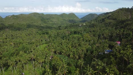 A-flight-over-a-little-village,-in-the-mountains-of-the-Philippines