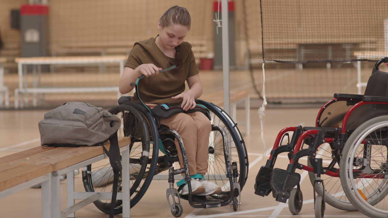Girl with Disability Getting Ready for Badminton Training