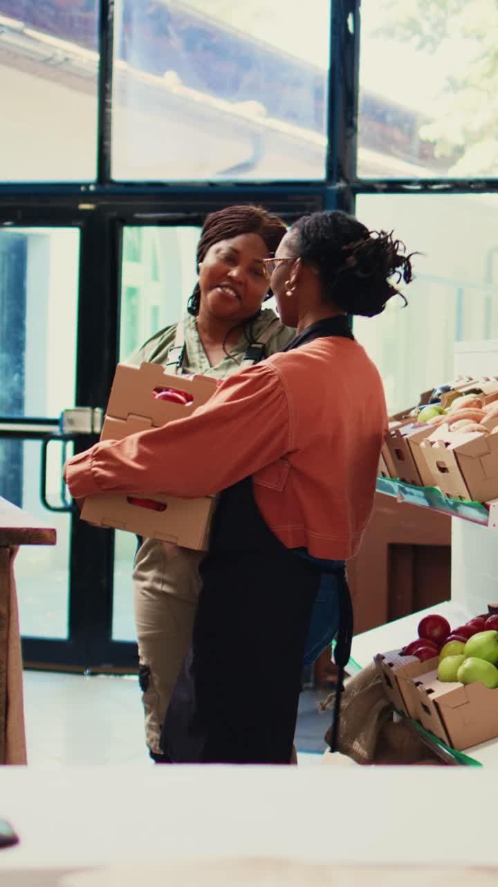 Vertical Video Supplier bringing fresh products to vendor at farmers market